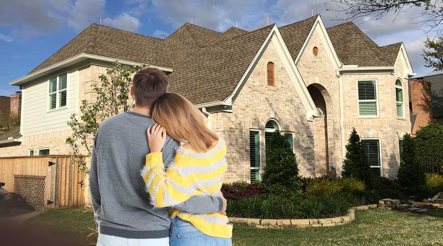 couple looking at their home